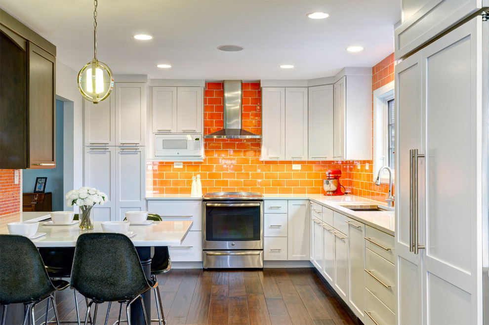 Inspiration for a contemporary l-shaped dark wood floor eat-in kitchen remodel in Columbus with an undermount sink, flat-panel cabinets, white cabinets, quartz countertops, orange backsplash, ceramic backsplash, stainless steel appliances and a peninsula
