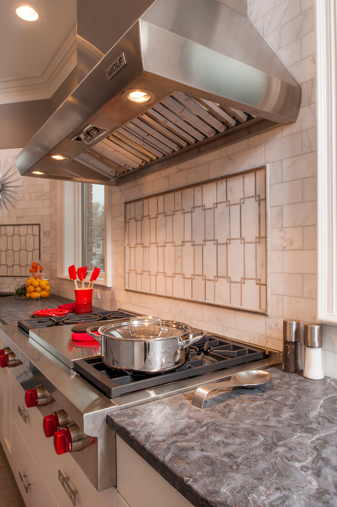 Example of a large trendy l-shaped ceramic tile open concept kitchen design in Detroit with an undermount sink, recessed-panel cabinets, white cabinets, quartz countertops, white backsplash, subway tile backsplash, stainless steel appliances and two islands