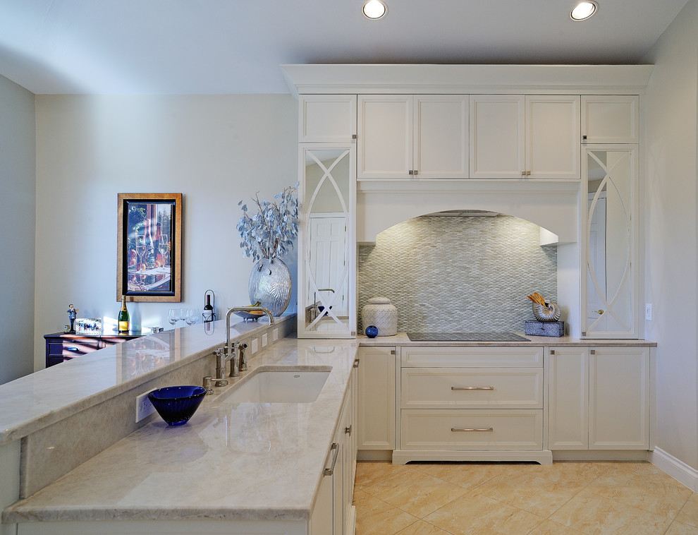 Eat-in kitchen - mid-sized transitional l-shaped eat-in kitchen idea in Miami with a double-bowl sink, recessed-panel cabinets, white cabinets, quartzite countertops, white backsplash, glass tile backsplash, paneled appliances and a peninsula