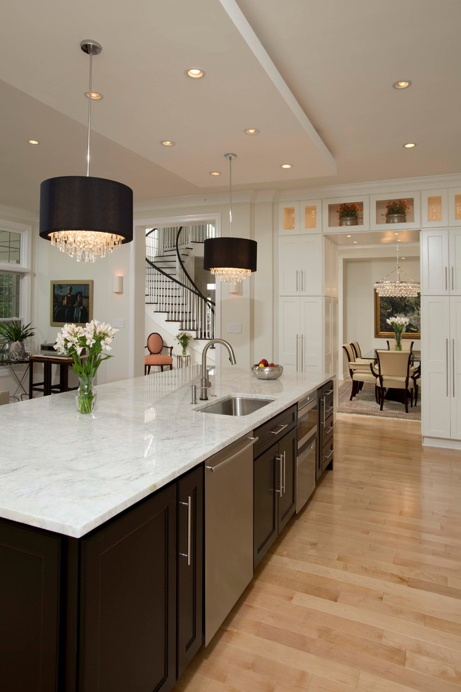 Example of a large trendy light wood floor open concept kitchen design in DC Metro with an undermount sink, shaker cabinets, white cabinets, marble countertops, multicolored backsplash, stone slab backsplash, stainless steel appliances and an island
