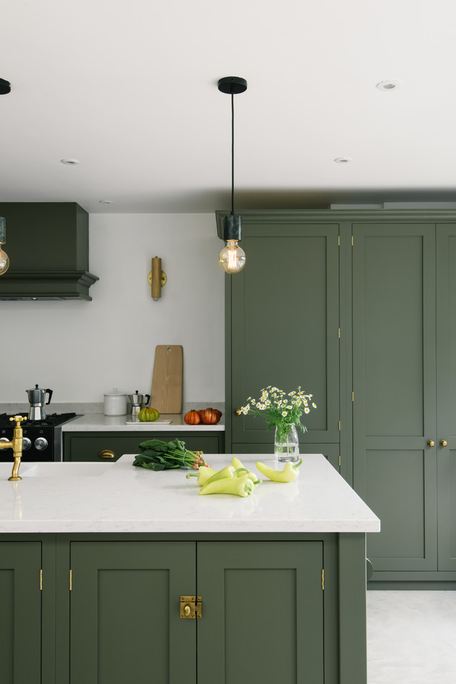 Inspiration for a medium sized contemporary kitchen/diner in Other with shaker cabinets, green cabinets, quartz worktops, white splashback, integrated appliances, an island and white worktops.