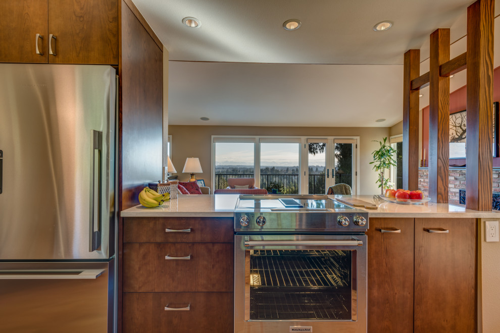 Example of a small 1960s galley porcelain tile and beige floor eat-in kitchen design in Seattle with an undermount sink, flat-panel cabinets, dark wood cabinets, quartz countertops, beige backsplash, porcelain backsplash, stainless steel appliances, a peninsula and white countertops