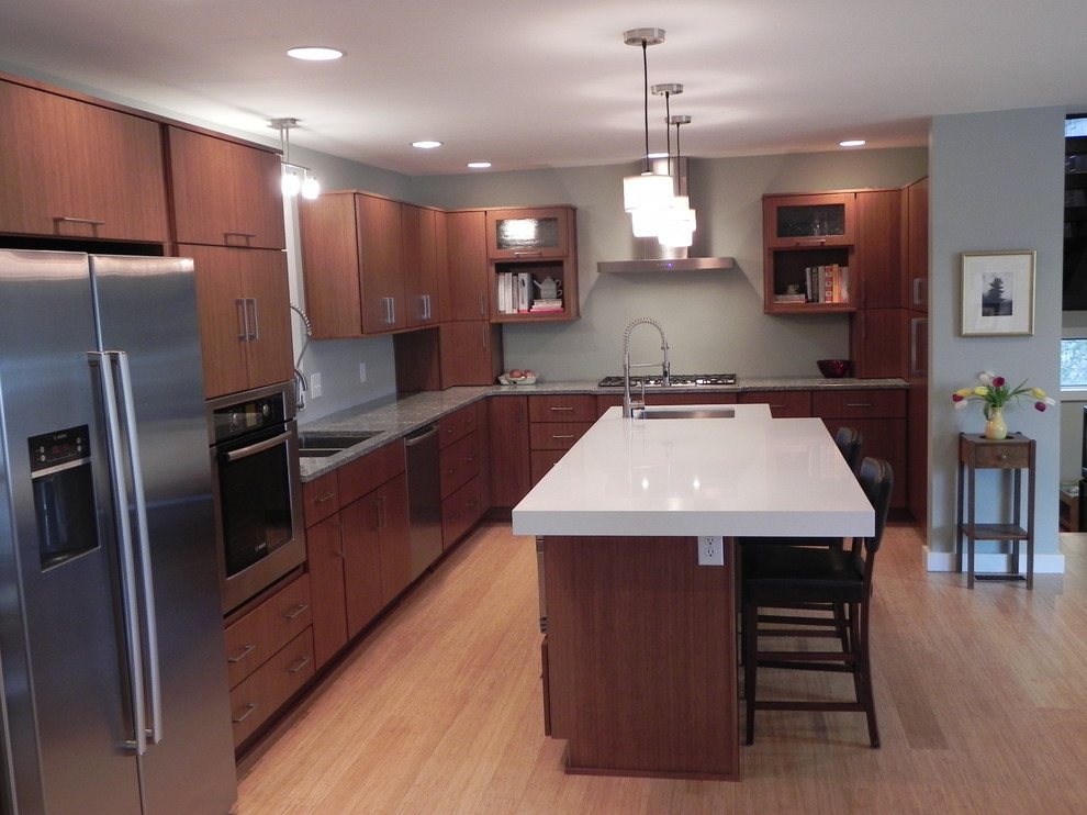 Example of a large trendy l-shaped light wood floor and beige floor open concept kitchen design in Indianapolis with a double-bowl sink, flat-panel cabinets, medium tone wood cabinets, quartzite countertops, stainless steel appliances and an island