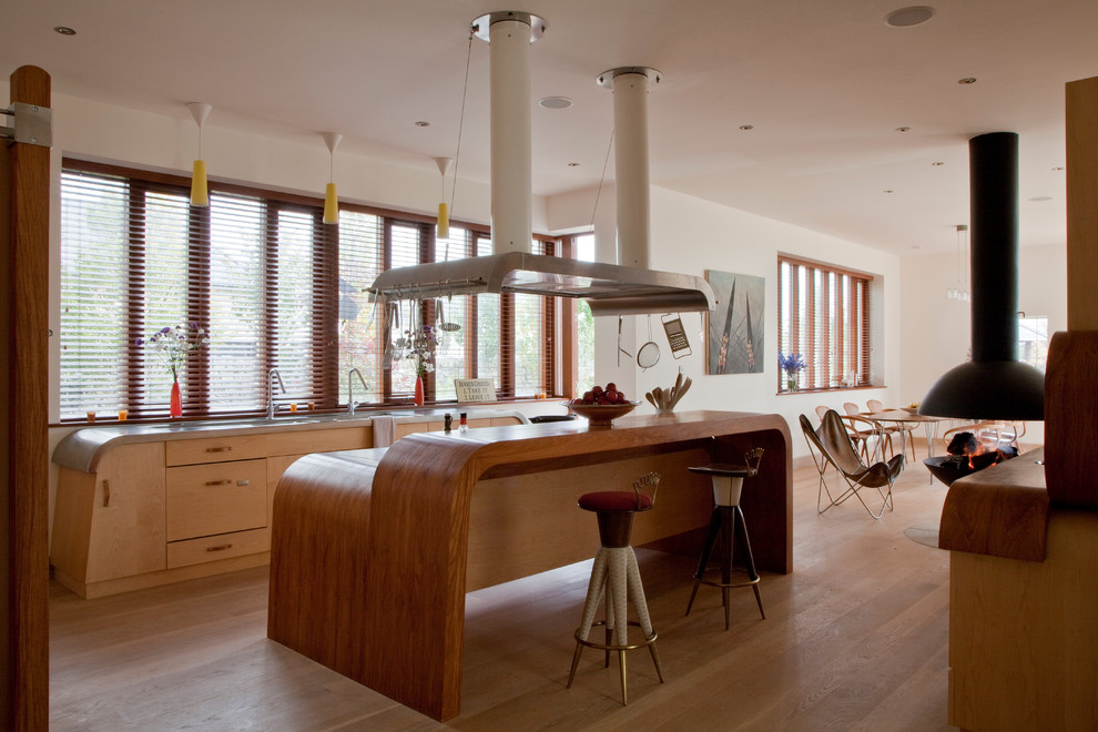 Large zen light wood floor eat-in kitchen photo in Hampshire with an undermount sink, green backsplash and an island