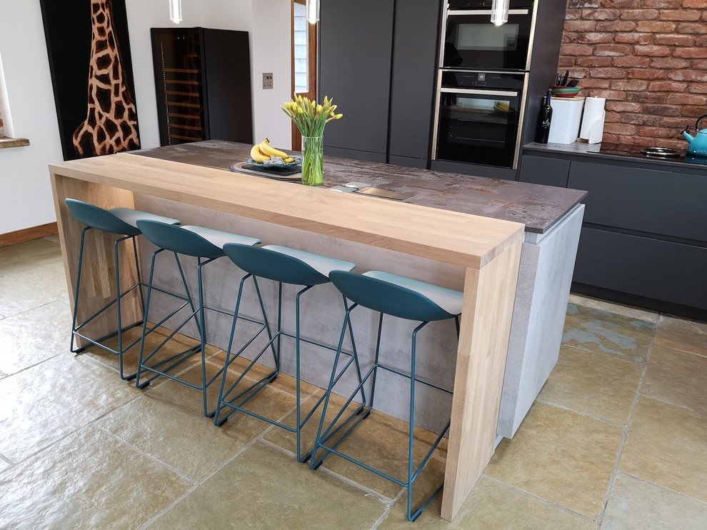 A modern, industrial style kitchen for a converted barn Industrial