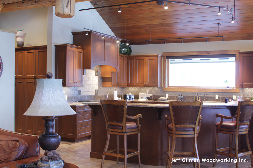 Example of a classic galley eat-in kitchen design in Other with an undermount sink, recessed-panel cabinets, medium tone wood cabinets, granite countertops, gray backsplash and paneled appliances