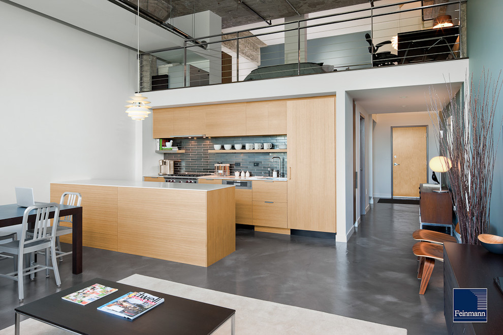 Open concept kitchen - contemporary single-wall gray floor open concept kitchen idea in Boston with flat-panel cabinets, light wood cabinets, gray backsplash and paneled appliances
