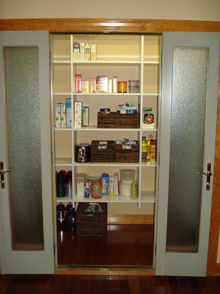 Example of a mid-sized classic u-shaped medium tone wood floor kitchen pantry design in Boston with open cabinets and no island