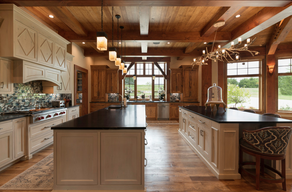 Photo of an expansive rustic galley kitchen in Dallas with multi-coloured splashback, black worktops and a wood ceiling.