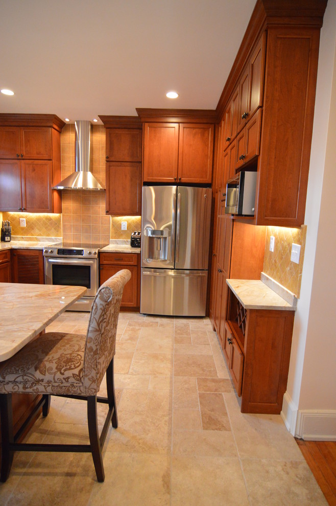 Mid-sized transitional u-shaped ceramic tile and beige floor eat-in kitchen photo in DC Metro with an undermount sink, shaker cabinets, medium tone wood cabinets, granite countertops, yellow backsplash, ceramic backsplash, stainless steel appliances, a peninsula and beige countertops