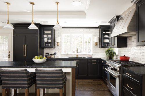 Countertops pairings for a black and gold kitchen and bath