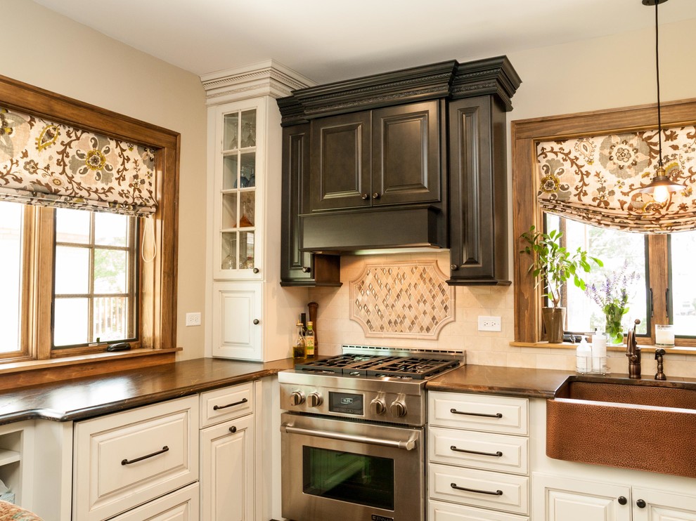 Design ideas for a traditional grey and cream kitchen in Chicago with stainless steel appliances and a belfast sink.