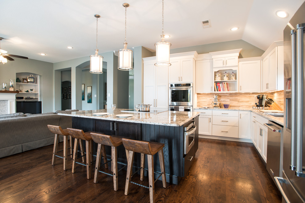 Mid-sized transitional l-shaped dark wood floor eat-in kitchen photo in Dallas with a drop-in sink, shaker cabinets, white cabinets, granite countertops, brown backsplash, porcelain backsplash, stainless steel appliances and an island