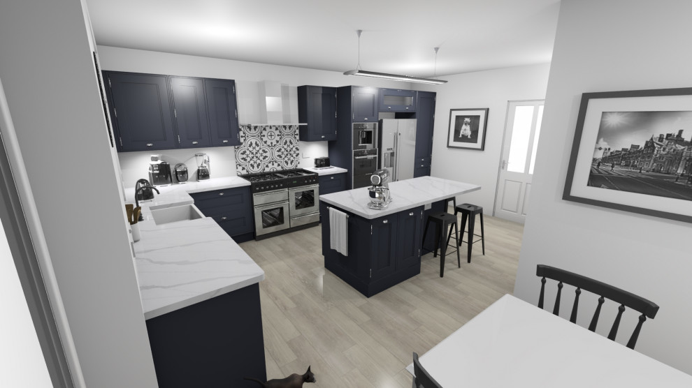 Medium sized classic l-shaped kitchen/diner in Dorset with a belfast sink, shaker cabinets, blue cabinets, engineered stone countertops, blue splashback, stainless steel appliances, medium hardwood flooring, an island, multi-coloured floors and white worktops.