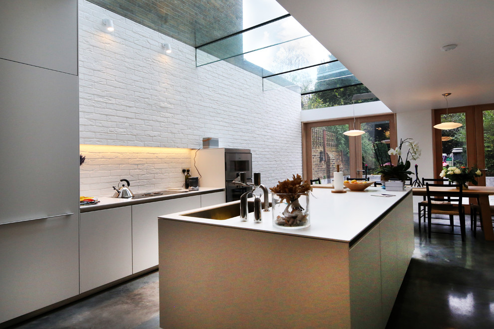 Example of a mid-sized trendy kitchen design in London