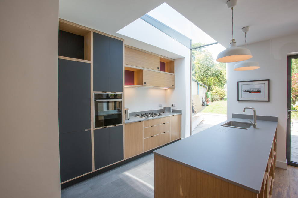 Inspiration for a medium sized contemporary single-wall open plan kitchen in Other with an island.