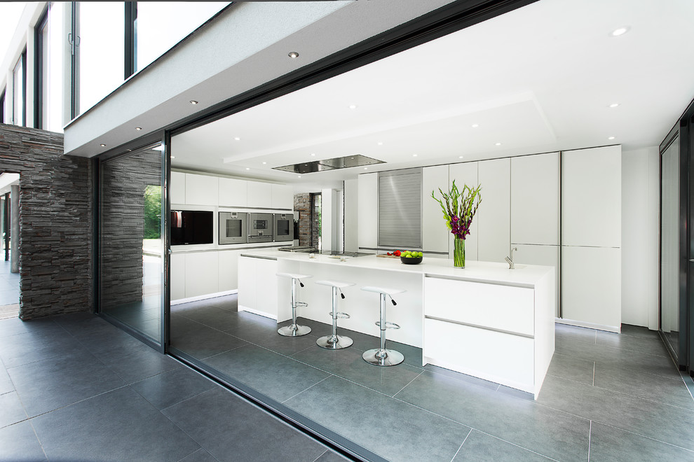 This is an example of a modern kitchen in Hampshire with stainless steel appliances.