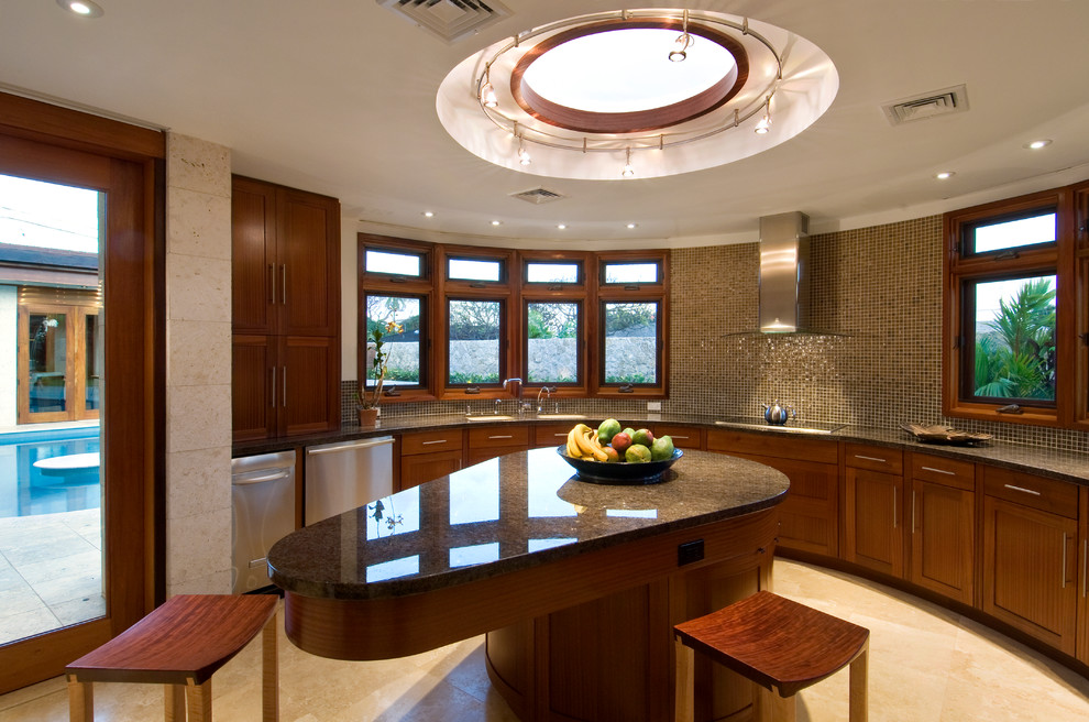 Example of a mid-sized trendy u-shaped travertine floor enclosed kitchen design in Hawaii with glass tile backsplash, brown backsplash, shaker cabinets, dark wood cabinets, a double-bowl sink, granite countertops, stainless steel appliances and an island