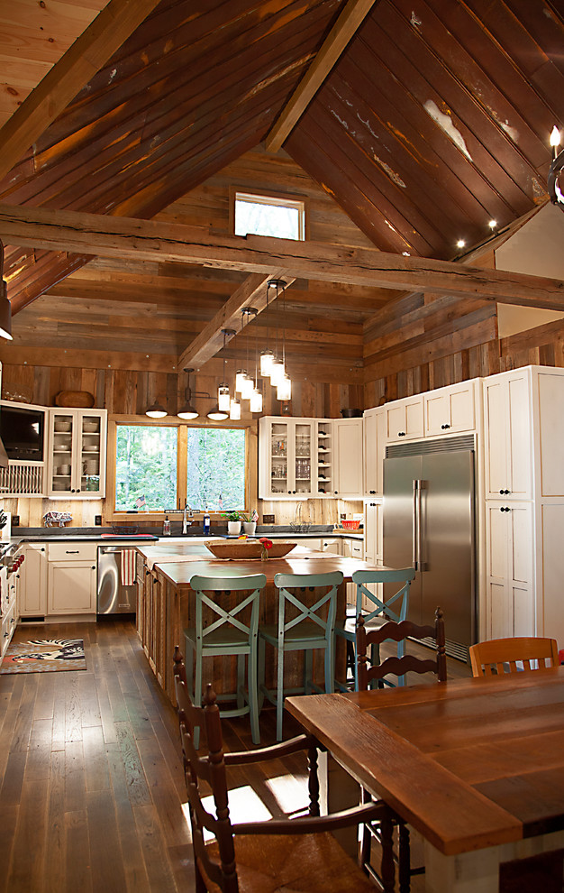 Photo of a large rustic kitchen in Other with an island.