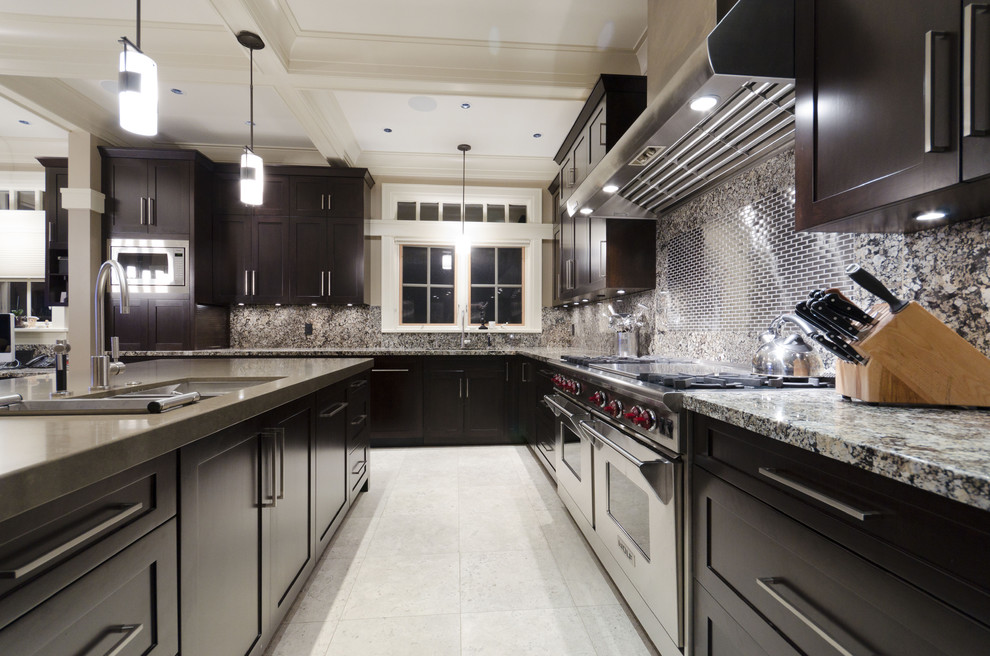 Inspiration for a contemporary kitchen remodel in Vancouver with an undermount sink, shaker cabinets, dark wood cabinets and stainless steel appliances