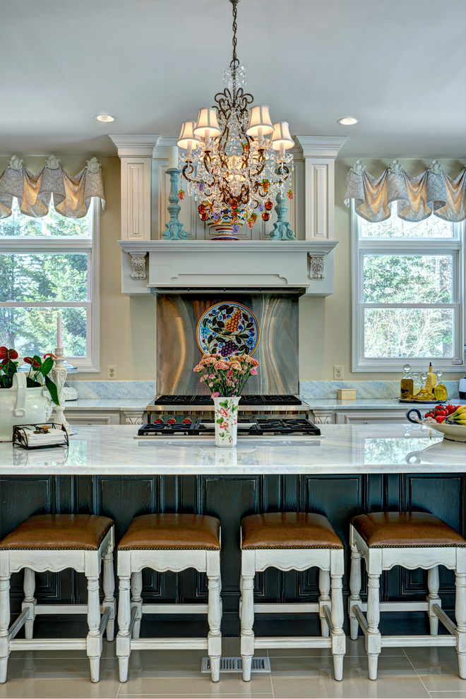 Inspiration for a large mediterranean l-shaped porcelain tile open concept kitchen remodel in DC Metro with a double-bowl sink, metallic backsplash, stainless steel appliances and an island