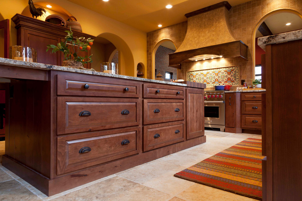 Inspiration for a southwestern kitchen remodel in Indianapolis with raised-panel cabinets and brown cabinets