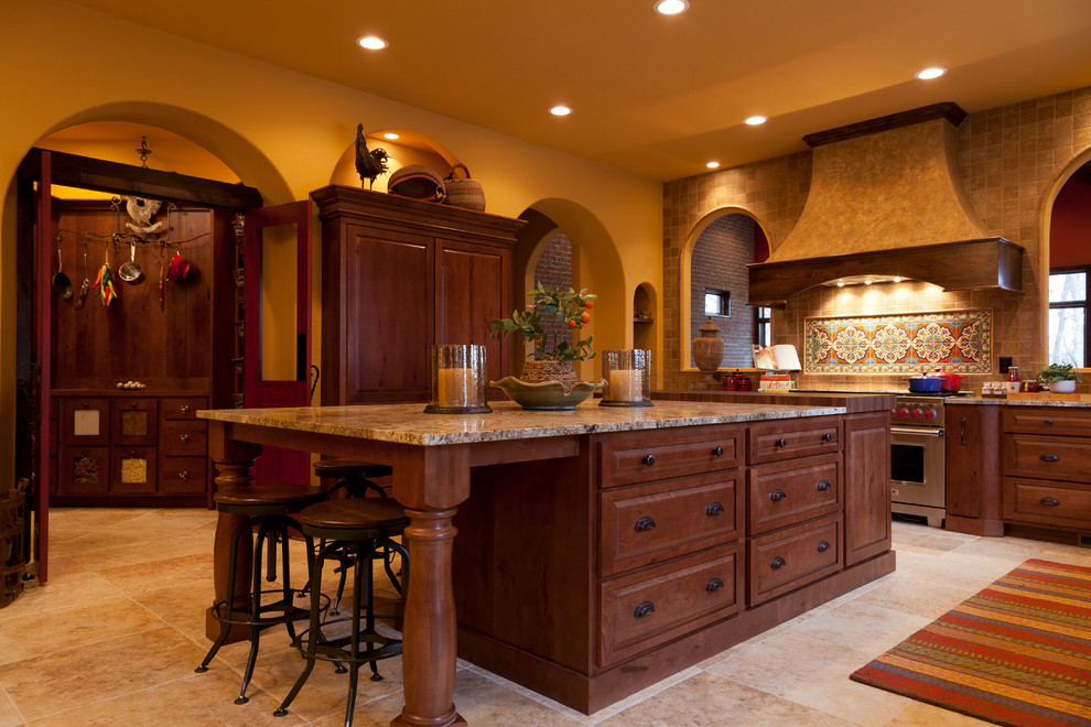 This is an example of a kitchen in Indianapolis with raised-panel cabinets and brown cabinets.