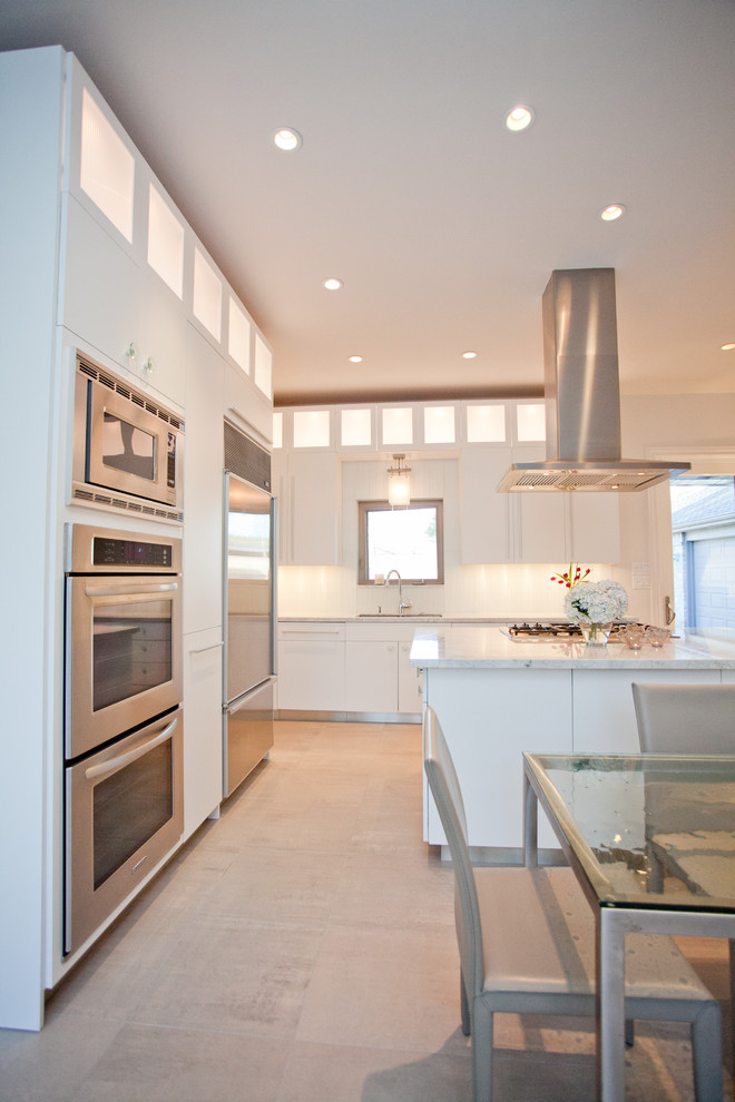 Example of a large trendy l-shaped ceramic tile open concept kitchen design in Houston with a double-bowl sink, flat-panel cabinets, white cabinets, quartzite countertops, stainless steel appliances, white backsplash and an island