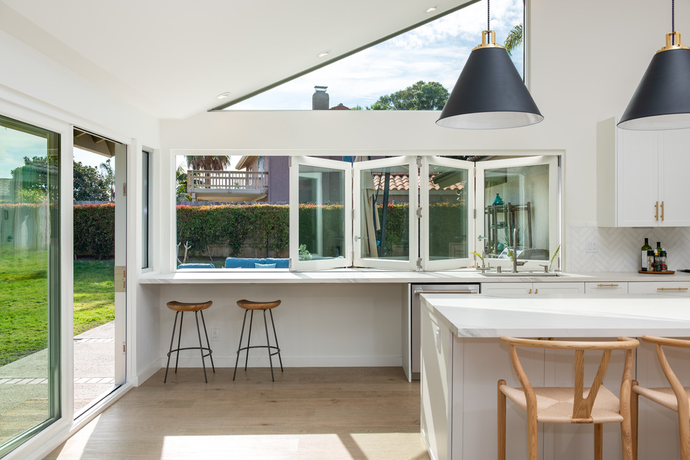AG BiFold Patio Door & Window Pairing Connects All-White Kitchen to the ...