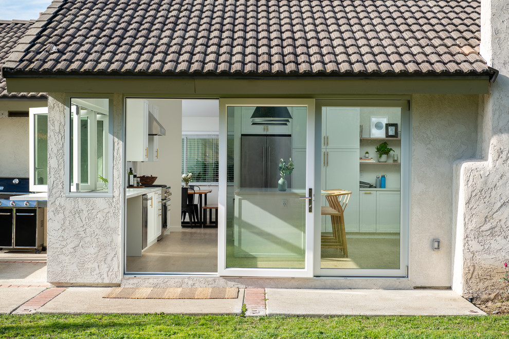 AG BiFold Patio Door & Window Pairing Connects All-White Kitchen to the ...