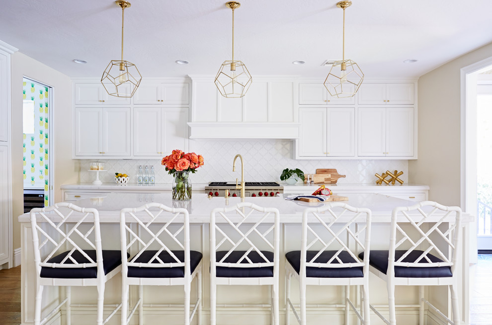 Enclosed kitchen - transitional galley enclosed kitchen idea in Phoenix with recessed-panel cabinets, white cabinets, white backsplash, stainless steel appliances and an island