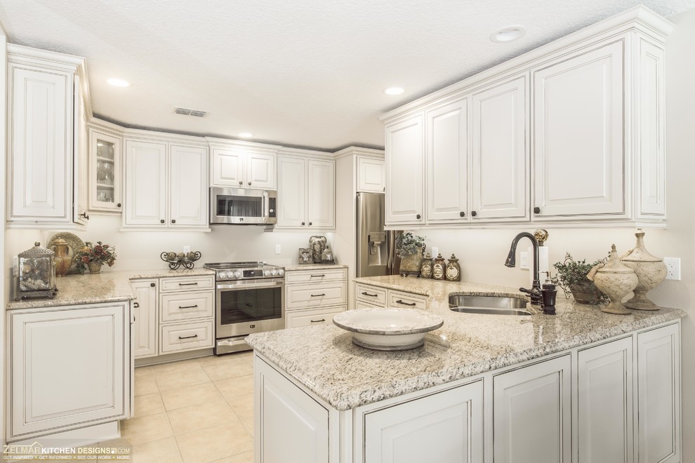 Design ideas for a medium sized traditional u-shaped kitchen/diner in Orlando with a submerged sink, raised-panel cabinets, beige cabinets, granite worktops and no island.