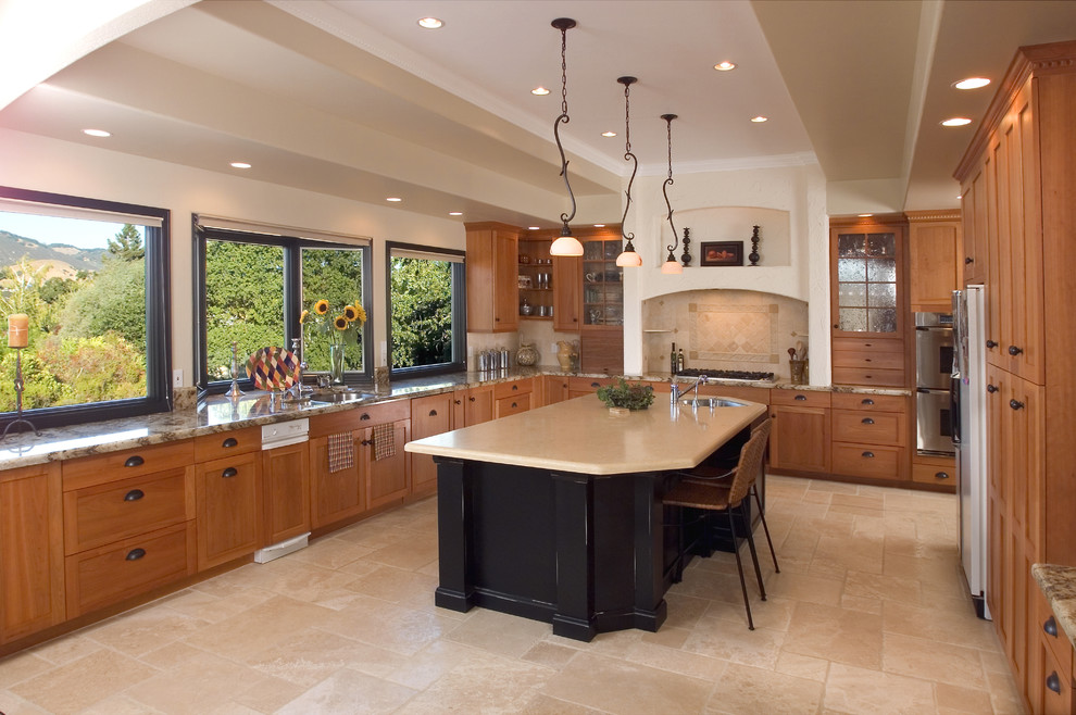 Enclosed kitchen - large traditional u-shaped ceramic tile enclosed kitchen idea in San Francisco with an undermount sink, shaker cabinets, medium tone wood cabinets, granite countertops, beige backsplash, ceramic backsplash, stainless steel appliances and an island