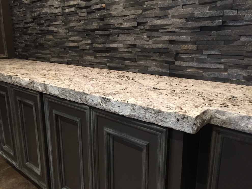 This is an example of a rustic kitchen in Houston with granite worktops, grey splashback and slate splashback.