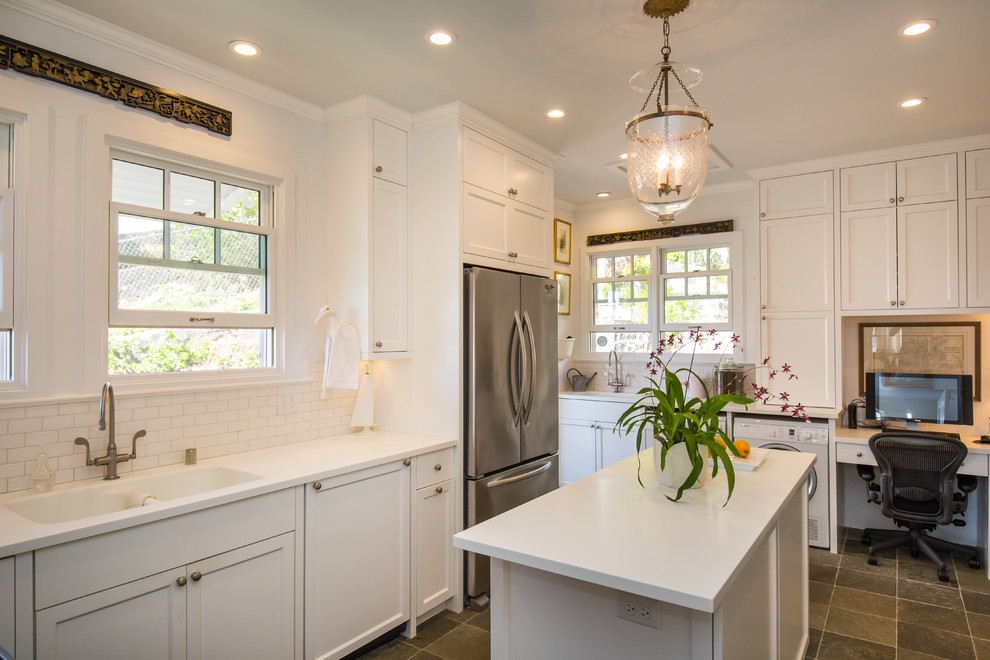 Inspiration for a large timeless u-shaped kitchen remodel in Hawaii with a double-bowl sink, shaker cabinets, white cabinets, white backsplash, stainless steel appliances, an island and subway tile backsplash