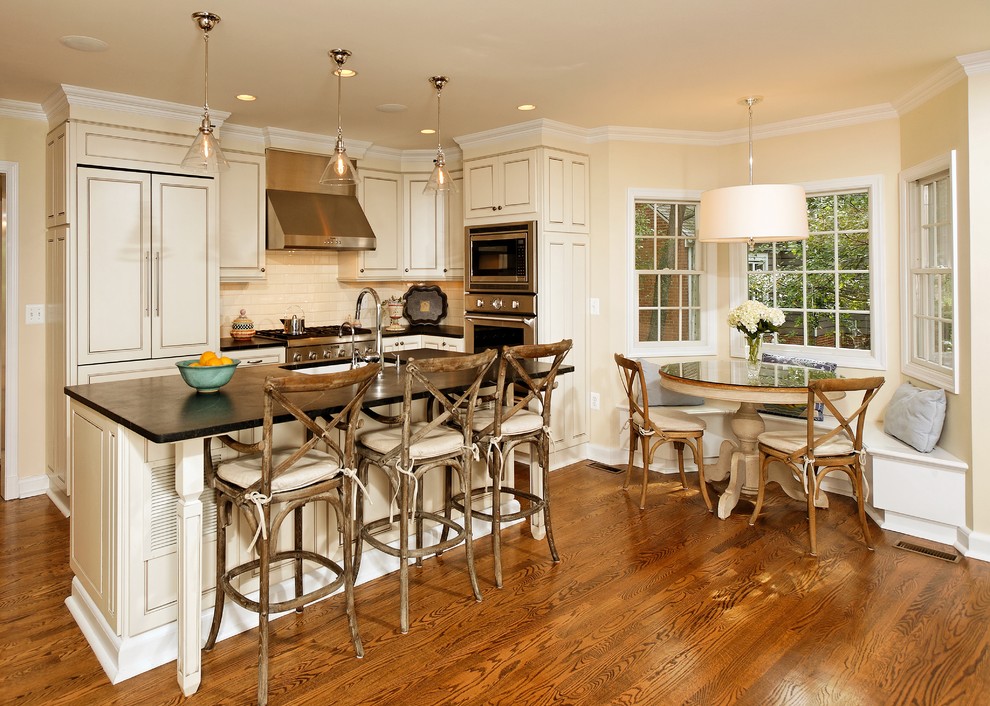 Elegant kitchen photo in DC Metro with paneled appliances