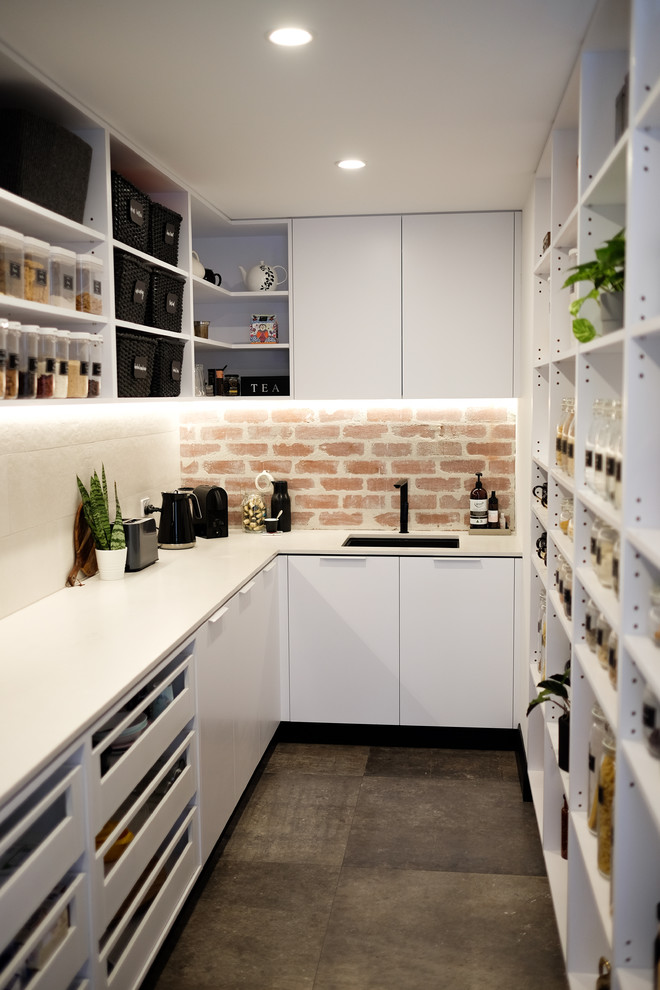 Mid-sized minimalist u-shaped porcelain tile and gray floor kitchen pantry photo in Perth with an undermount sink, open cabinets, white cabinets, quartz countertops, multicolored backsplash, brick backsplash and white countertops