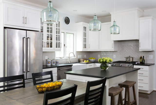 modern white kitchen cabinets with black countertops