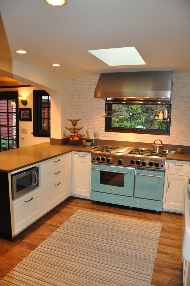 Inspiration for a transitional kitchen remodel in Seattle with colored appliances