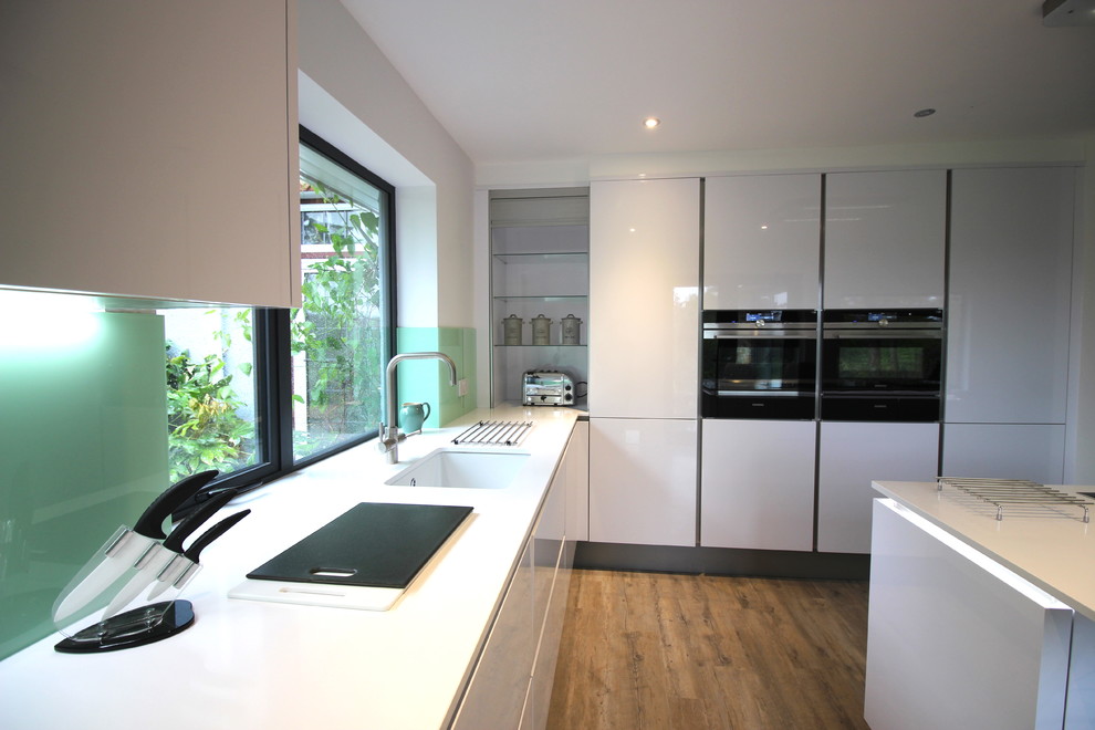 Example of a trendy kitchen design in Sussex