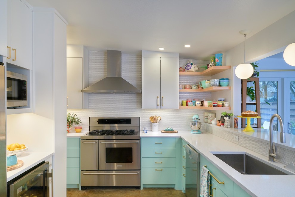 Inspiration for a 1950s l-shaped brown floor kitchen remodel in Austin with an undermount sink, flat-panel cabinets, turquoise cabinets, white backsplash, mosaic tile backsplash, stainless steel appliances, a peninsula and white countertops