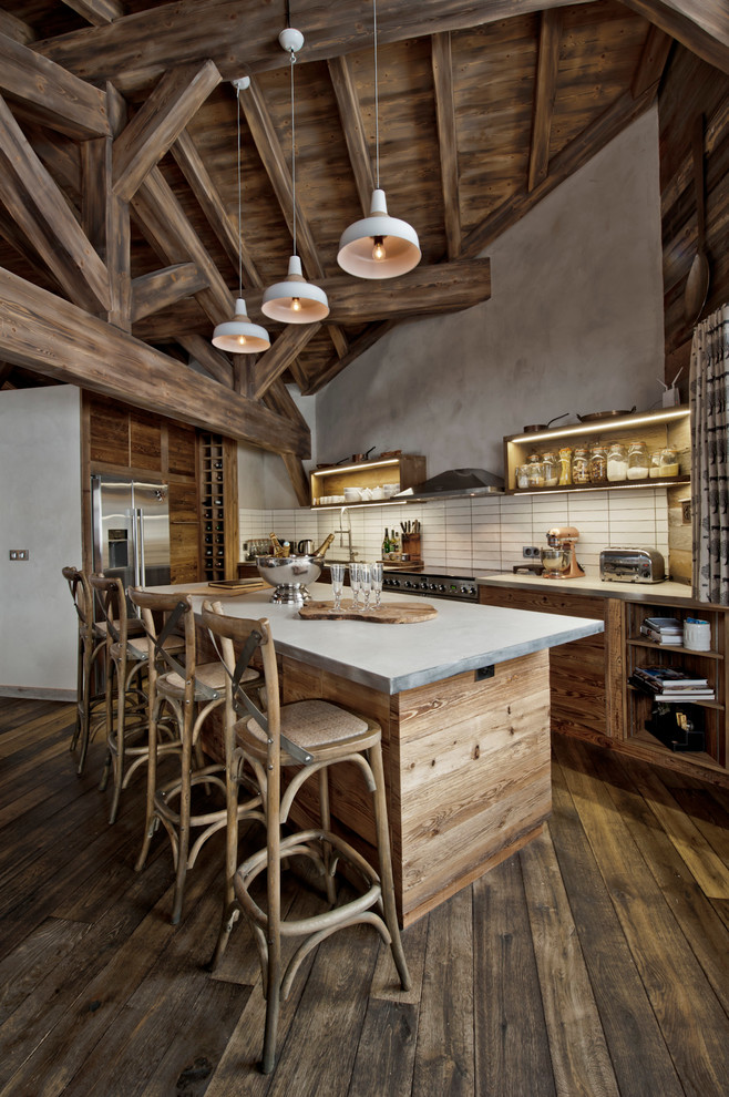 Eat-in kitchen - mid-sized rustic l-shaped dark wood floor eat-in kitchen idea in London with a farmhouse sink, marble countertops, beige backsplash and stainless steel appliances