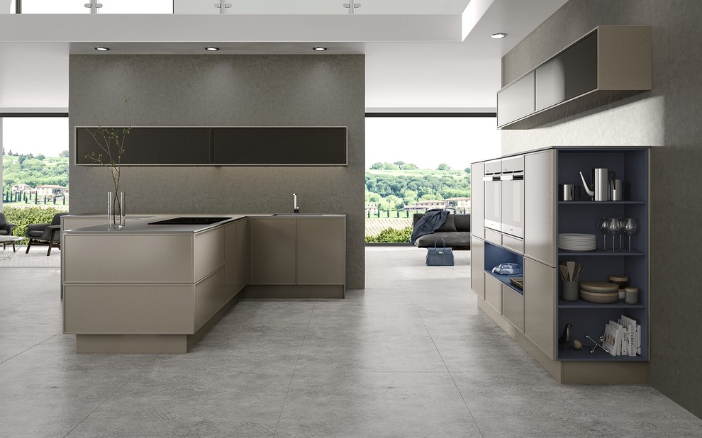 This is an example of a large contemporary single-wall kitchen/diner in Cambridgeshire with an integrated sink, raised-panel cabinets, medium wood cabinets, quartz worktops, multi-coloured splashback, glass tiled splashback, stainless steel appliances, concrete flooring and an island.