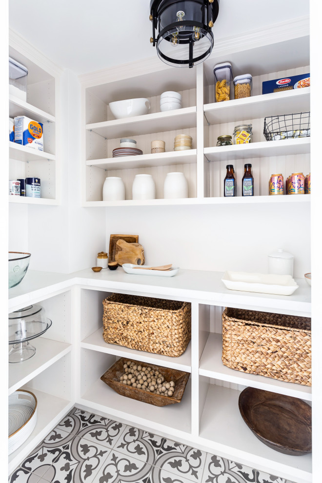 Mid-sized farmhouse l-shaped multicolored floor kitchen pantry photo in Los Angeles with open cabinets, white cabinets and white countertops