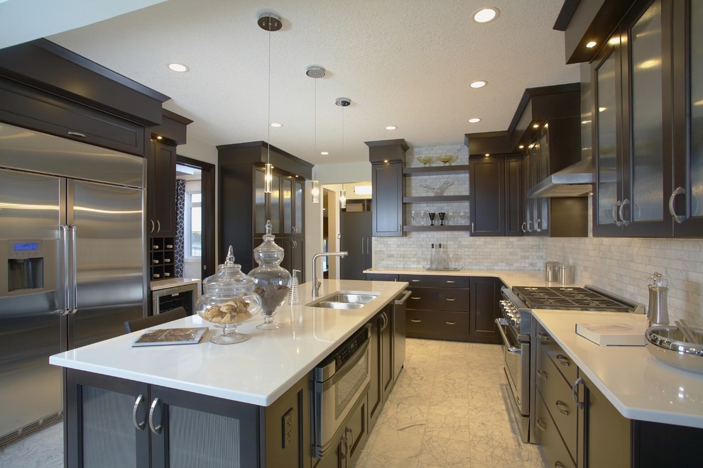 Kitchen - transitional kitchen idea in Calgary with stainless steel appliances and subway tile backsplash