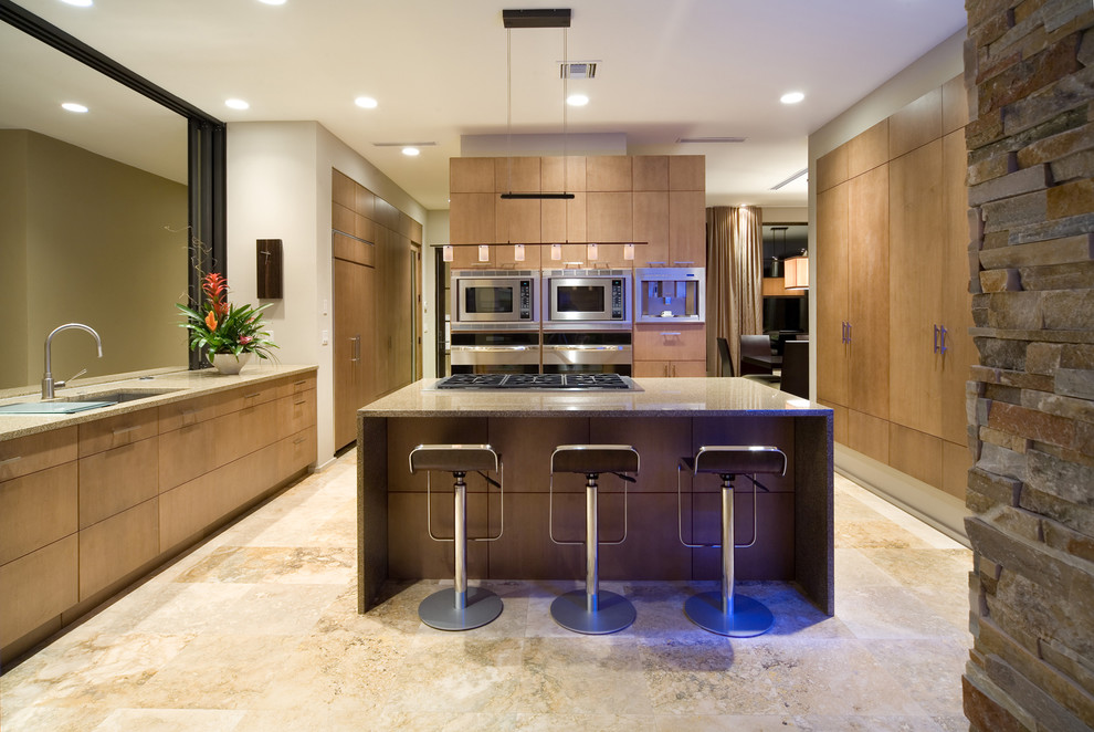 Contemporary kitchen in Orlando with medium wood cabinets, stainless steel appliances and an island.