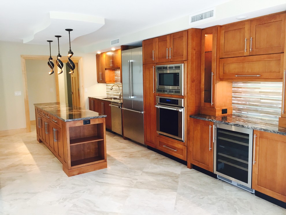 Huge arts and crafts galley marble floor eat-in kitchen photo in Miami with an undermount sink, shaker cabinets, medium tone wood cabinets, granite countertops, metallic backsplash, metal backsplash, stainless steel appliances and two islands
