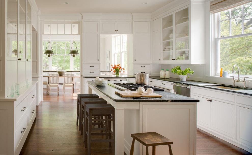 Elegant u-shaped kitchen photo in DC Metro with an undermount sink, recessed-panel cabinets, white cabinets and stainless steel appliances