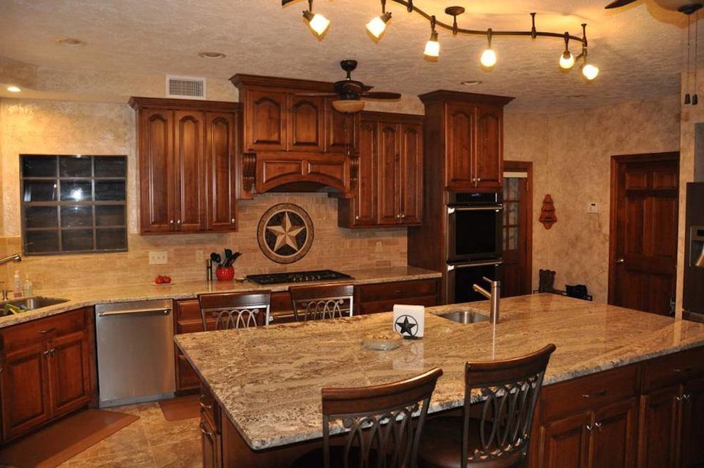 Example of a large classic l-shaped ceramic tile eat-in kitchen design in Houston with an undermount sink, raised-panel cabinets, medium tone wood cabinets, granite countertops, beige backsplash, ceramic backsplash, stainless steel appliances and an island