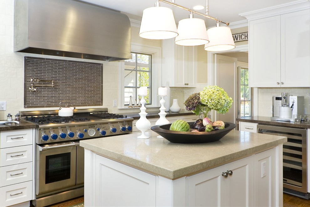 Inspiration for a contemporary enclosed kitchen remodel in San Francisco with stainless steel appliances, recessed-panel cabinets, white cabinets, multicolored backsplash and matchstick tile backsplash